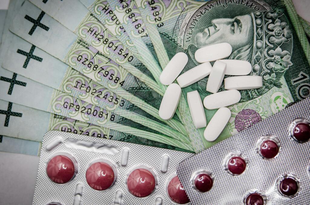 Medicines and banknotes laid out on a table